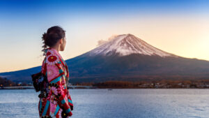 Asian woman wearing japanese traditional kimono at Fuji mountain