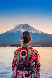 Asian woman wearing japanese traditional kimono at Fuji mountain